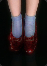Judy Garland as Dorothy wearing the ruby slippers